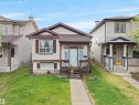 Two-story exterior with light-toned siding and dark trim accents - 15511 45 Street Nw, Edmonton, AB 