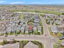 Residential neighborhood with a curved street layout, mature trees, and a visible water body - 15511 45 Street Nw, Edmonton, AB 