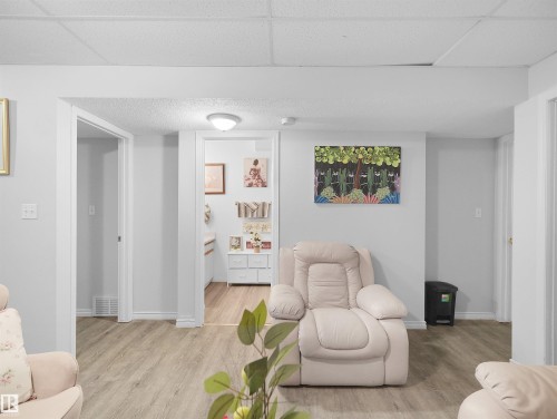 Recessed ceiling lighting, wood-finish flooring, white wall paint, and white trim - 15511 45 Street Nw, Edmonton, AB 