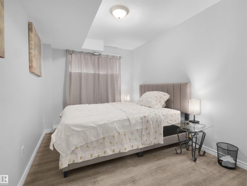 Recessed ceiling lighting, durable wood-finish flooring, and light-toned walls - 15511 45 Street Nw, Edmonton, AB 