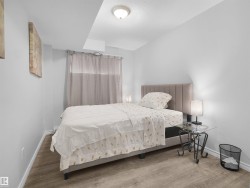 Recessed ceiling lighting, durable wood-finish flooring, and light-toned walls - 