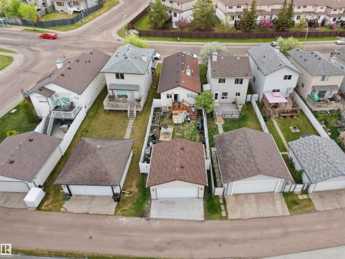 Detached residence featuring a private backyard, rear deck, and a detached two-car garage - 15511 45 Street Nw, Edmonton, AB 