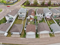Detached residence featuring a private backyard, rear deck, and a detached two-car garage - 