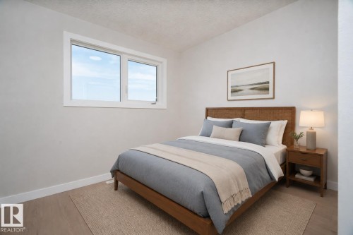 Neutral wall finish with a white trim, wood-finish flooring, and a large window AI VIRTUAL STAGING - 904 Knottwood S Nw, Edmonton, AB 