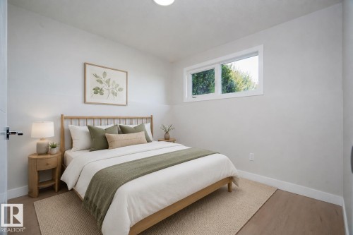 Neutral wall tones, wood-finish flooring, a contemporary window, and a flush-mount ceiling light AI VIRTUAL STAGING - 904 Knottwood S Nw, Edmonton, AB 