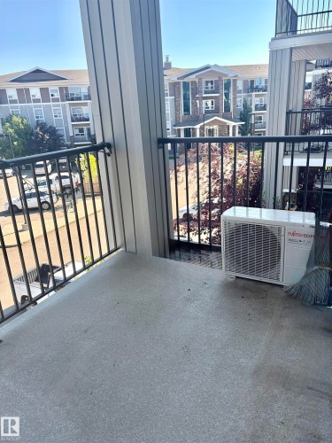 Outdoor balcony with black metal railings and a concrete floor - #1304 9363 Simpson Dr Nw, Edmonton, AB 