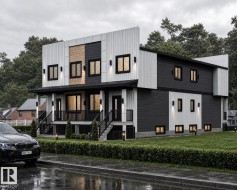 Modern architectural facade featuring contrasting dark and light siding, multiple large windows with horizontal blinds, covered entryways with black railings, and integrated exterior lighting fixtures - 