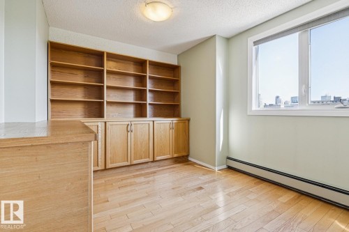 Built-in wood-finish shelving and cabinetry - #905 9929 113 St Nw, Edmonton, AB 