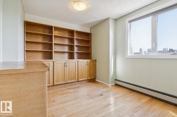 Built-in wood-finish shelving and cabinetry - 