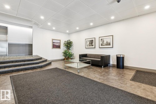 Recessed ceiling lighting illuminates the tiled flooring and white walls - #905 9929 113 St Nw, Edmonton, AB 
