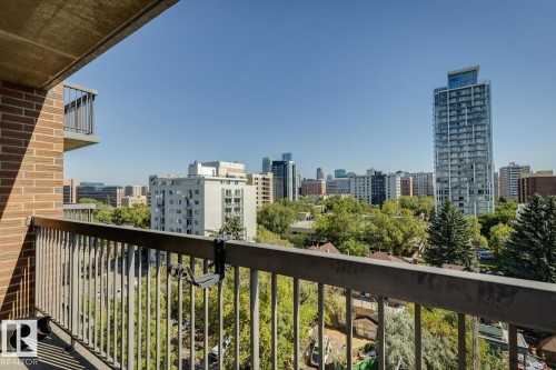 Balcony with metal railing and brick exterior - #905 9929 113 St Nw, Edmonton, AB 