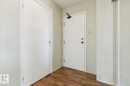 Wood-finish flooring with white trim - #905 9929 113 St Nw, Edmonton, AB 