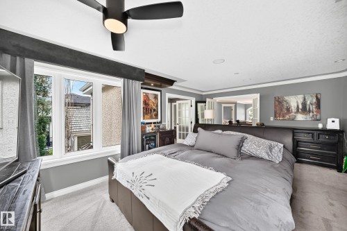 Recessed lighting, crown molding, and a ceiling fan with integrated lighting - 417 Caldwell Place Nw, Edmonton, AB 