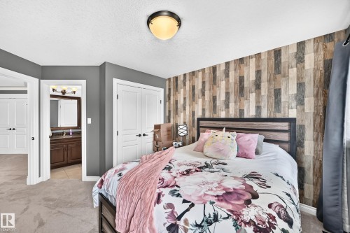 Accent wall featuring wood-look paneling - 417 Caldwell Place Nw, Edmonton, AB 