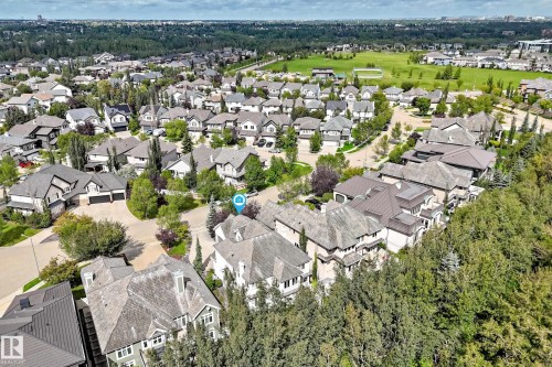 Aerial perspective of a developed residential area with mature trees and a manicured green space - 417 Caldwell Place Nw, Edmonton, AB 