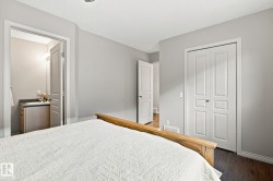 Wood-finish flooring, light grey wall paint, and white trim - 