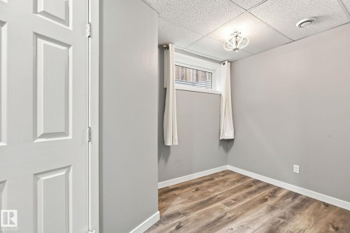 Wood-finish flooring with crisp white trim - 30 Belfry Fairway Crescent, Stony Plain, AB 