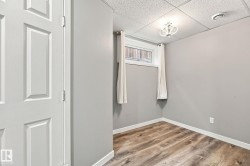 Wood-finish flooring with crisp white trim - 