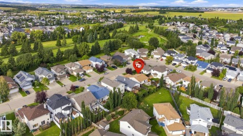 Residential neighborhood featuring a variety of housing styles, established landscaping, and proximity to green spaces - 30 Belfry Fairway Crescent, Stony Plain, AB 