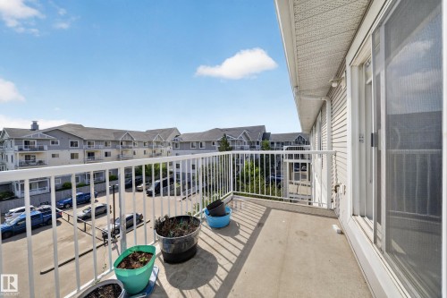 Private balcony featuring a concrete floor and white metal railing - #419 4407 23 St Nw, Edmonton, AB 