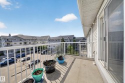 Private balcony featuring a concrete floor and white metal railing - 