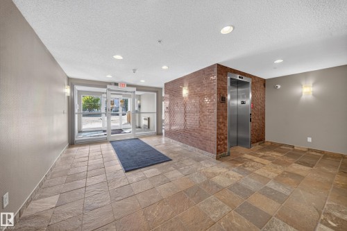 Tiled flooring extends through the space - #419 4407 23 St Nw, Edmonton, AB 