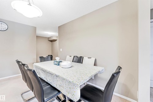 Recessed ceiling light fixture, neutral wall paint, and carpet flooring - #225 111 Watt Cm Sw, Edmonton, AB 