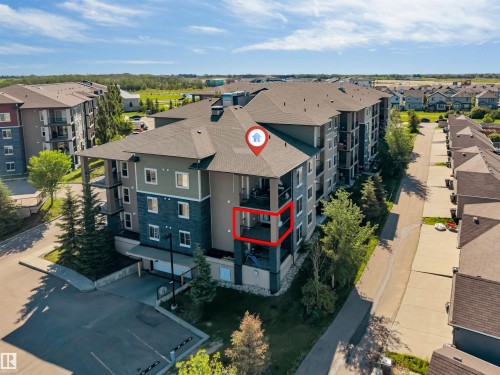 Multi-story residential building with private balconies and covered parking - #225 111 Watt Cm Sw, Edmonton, AB 
