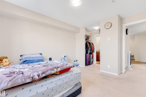 Recessed lighting, light-toned carpeting, and an open wardrobe alcove - #225 111 Watt Cm Sw, Edmonton, AB 