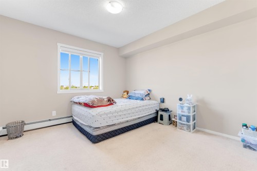 Recessed window with white trim, wall-to-wall carpeting, and neutral wall paint - #225 111 Watt Cm Sw, Edmonton, AB 