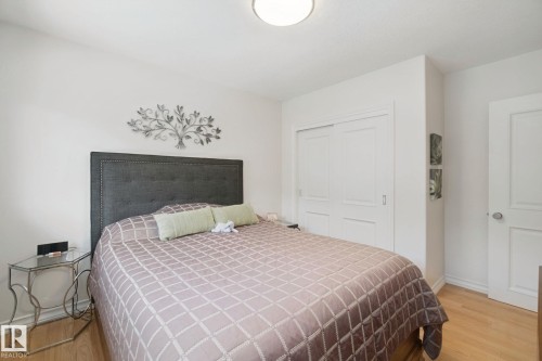 Hardwood-finish flooring, white walls, and a ceiling-mounted light fixture - 12916 63 Street Nw, Edmonton, AB 