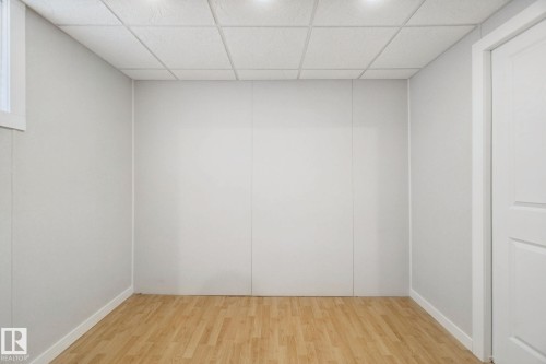 Recessed lighting, wood-finish flooring, white paneled walls, and a dropped ceiling - 12916 63 Street Nw, Edmonton, AB 