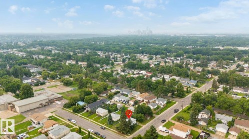 Aerial perspective of a residential neighborhood featuring tree-lined streets and a mix of single-family homes - 12150 47 Street Nw, Edmonton, AB - Outdoor With View