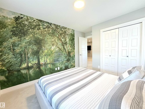 Accent wall with custom mural - 1003 Goldfinch Way Nw, Edmonton, AB 