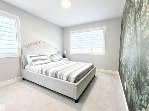 Wall-to-wall carpeting and neutral wall tones - 1003 Goldfinch Way Nw, Edmonton, AB 