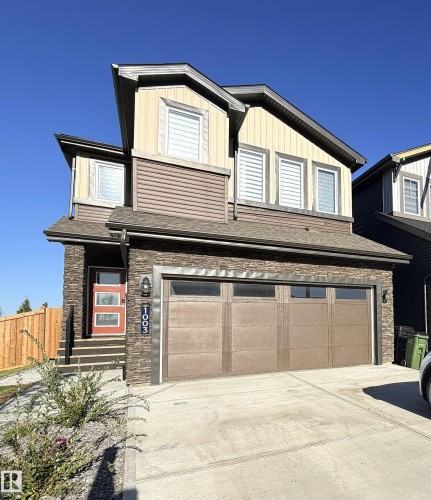 Multi-level siding exterior with stacked stone accents - 1003 Goldfinch Way Nw, Edmonton, AB 