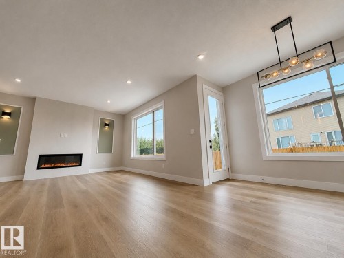16 Middleton Close, Leduc, AB - Indoor Photo Showing Living Room With Fireplace