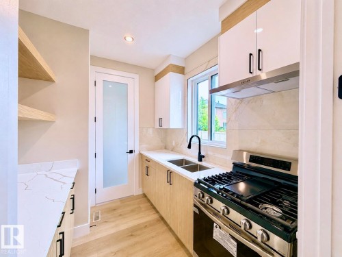 16 Middleton Close, Leduc, AB - Indoor Photo Showing Kitchen With Double Sink