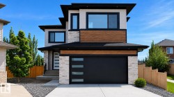 Contemporary two-story exterior with a contrasting facade of light-colored stone, wood-finish siding, and cream-colored paneling - 
