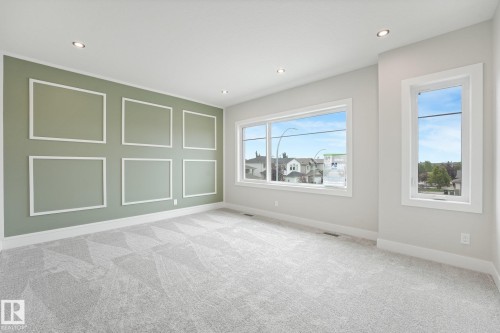 Bright, light-filled room featuring abundant natural light from multiple large windows with expansive sightlines to the surrounding landscape - 16 Middleton Close, Leduc, AB 