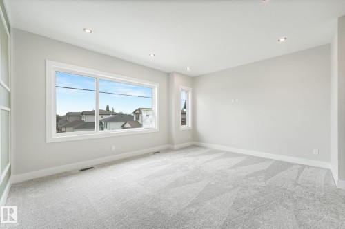 Recessed lighting, light-toned walls, and neutral carpeting - 16 Middleton Close, Leduc, AB 