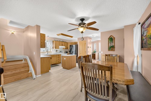 Wood-finish flooring throughout the main level - 1223 Gillespie Crescent Nw, Edmonton, AB 