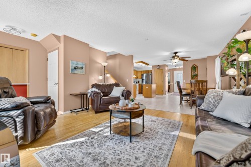 Wood-finish flooring throughout, recessed lighting, and a ceiling fan with light kit - 1223 Gillespie Crescent Nw, Edmonton, AB 