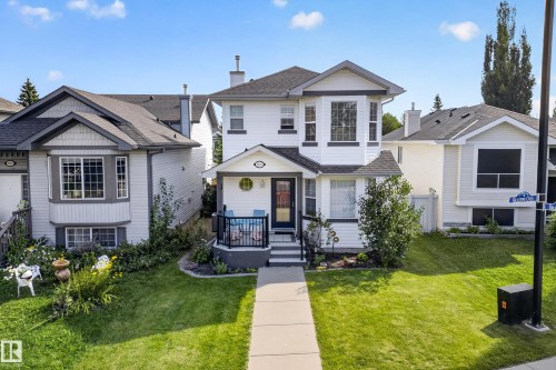 Two-story exterior with white siding and dark trim - 1223 Gillespie Crescent Nw, Edmonton, AB 