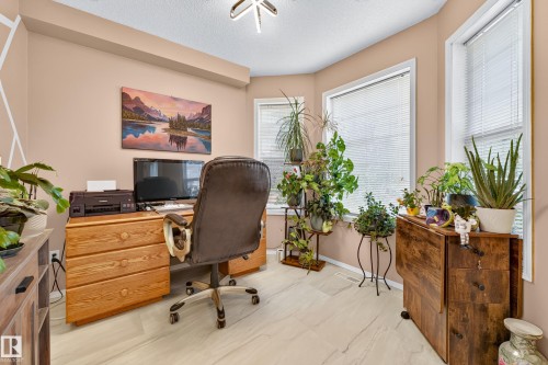 Light-toned flooring, multiple windows with blinds, and a neutral wall color - 1223 Gillespie Crescent Nw, Edmonton, AB 