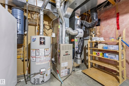 Central vacuum system, water heater, and furnace in utility space - 15213 49A Street Nw, Edmonton, AB 