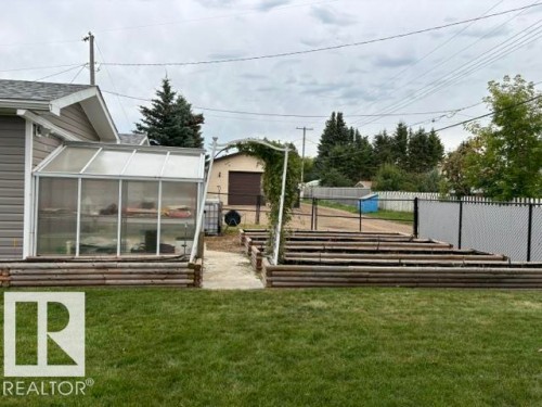 Greenhouse structure with aluminum framing and translucent panels - 5133 45A Avenue, Vegreville, AB 