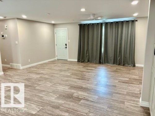 Wood-finish flooring, recessed lighting, and a ceiling fan - 5133 45A Avenue, Vegreville, AB 