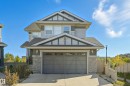 Contemporary two-story residence featuring a gray exterior with stone accents and horizontal siding - 1590 Chapman Way Sw, Edmonton, AB  - Outdoor 