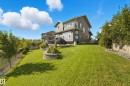 Expansive backyard with a sloped lawn and mature perimeter trees - 1590 Chapman Way Sw, Edmonton, AB  - Outdoor 
